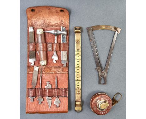 A German nickel plated steel miniature tool kit, c1900, comprising folding knife and seven accessories, including awl, pick, 