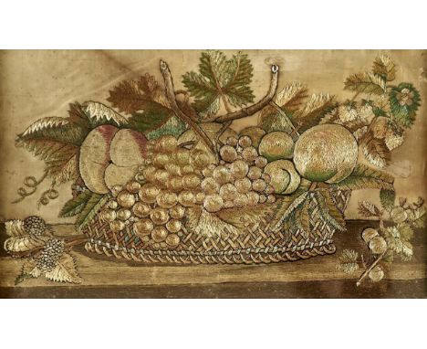 An embroidered silk picture of a basket of fruit, early 19th c, the oval basket with trellis sides overflowing with grapes, s