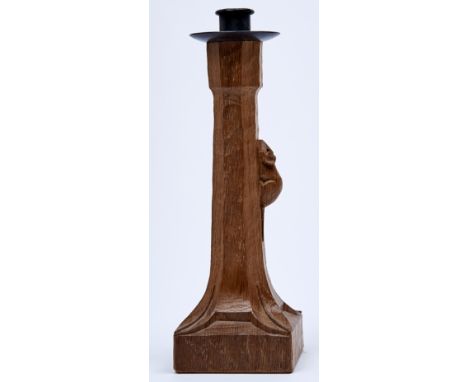 Robert 'Mouseman' Thompson of Kilburn - an oak candlestick of adzed slightly tapered octagonal form, the column carved with s