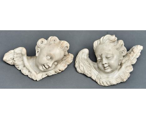 English School, 18th c -&nbsp;The Heads of two Cherubim, well carved with ecstatic expressions, gracefully curled hair and fe