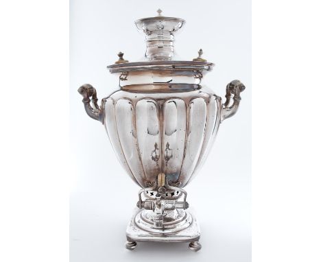 An Austro-Hungarian EPNS samovar, late 19th c, of shield shape with lobed body and upswept handles with ivory ring mounts, on
