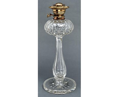 A Victorian cut glass oil lamp, c1880, the compressed fount with printies on baluster pillar and substantial star cut foot, b