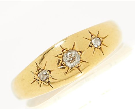 A three stone diamond ring, gypsy set in 18ct gold, London 1917, 2.6g, size O  Light wear consistent with age