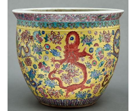 A&nbsp;&nbsp;Chinese famille jaune ground&nbsp; jardiniere, 20th c,&nbsp;&nbsp; the body decorated with nine coloured dragons