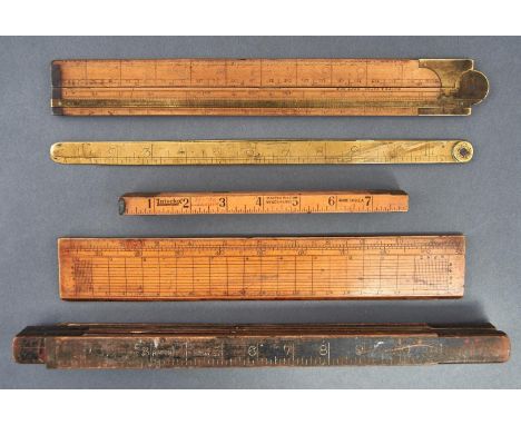 Two boxwood rules, 19th c, the folding example marked White &amp; Bates Best Box, two other folding rules and a brass folding