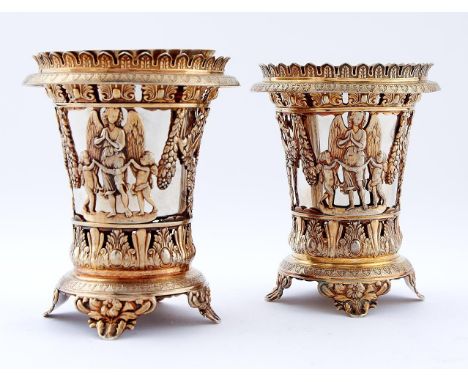 A pair of Italian silver gilt openwork vases, in Empire style and of beaker form, decorated with children and an angel, festo