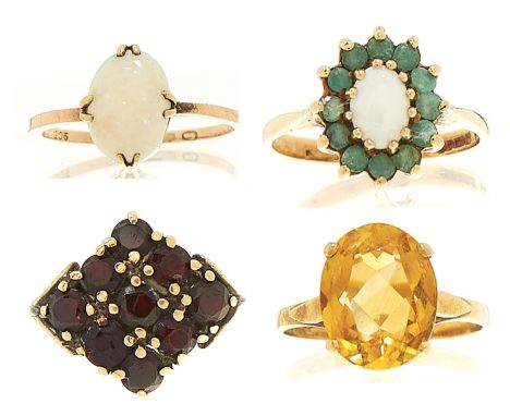 Four gold rings, variously gem set, variously marked, 10.8g, sizes K½, M and P  Good condition with light wear consistent wit