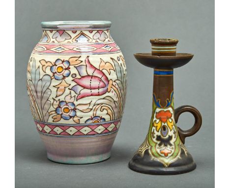 Charlotte Rhead. A Bursley ware ribbed baluster vase,&nbsp; slip trail decorated with stylised flowerheads and leafage within