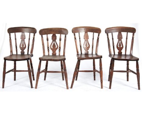 A set of four Edwardian ash kitchen chairs with pierced splat and elm seat, seat height 44cm  Dirty / light wear consistent w