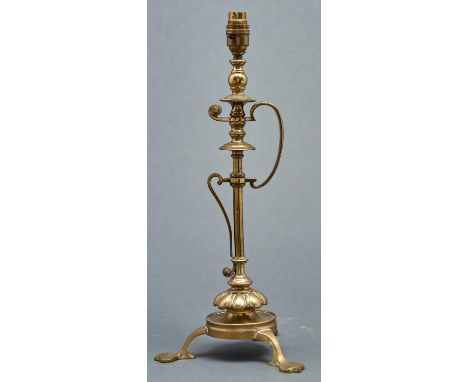 An unusual early electric handled brass table lamp, c1920, the knopped pillar on lobed base and round foot with three legs, 3