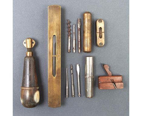 Tools and bygones. An English brass and steel plumb bob, early 19th c, shield shaped with steel tip, 10cm h, a Victorian bras