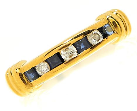 A seven stone sapphire and diamond ring, with calibre cut sapphires, in 18ct gold, import marked, London 1995, 4.1g, size K  