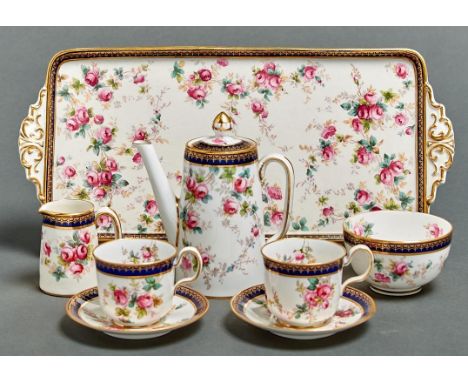 A Copeland bone china cabaret set, c1910, decorated with roses in cobalt and gilt border and a contemporary Copeland earthenw