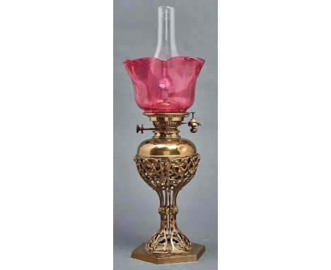 A Victorian brass openwork oil lamp, c1880, of anthemion and leaves design with rosettes, on hexagonal foot with detachable b