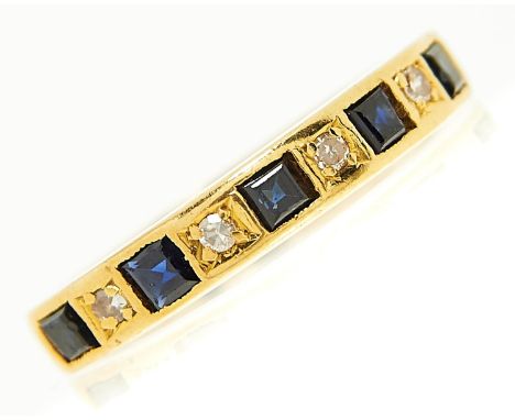 A nine stone sapphire and diamond ring with calibre cut sapphires, in 18ct gold, Birmingham 1972, 3.3g, size M  Slight wear, 