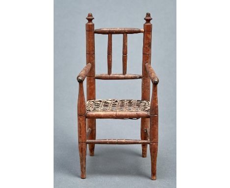 Miniature furniture. An Edwardian spindle turned light wood armchair, c1910, caned seat, 23.5cm h  Complete, minor knocks and