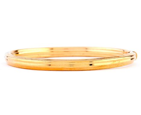 A gold bangle, 68mm, marked 9kt, 12g  Good condition