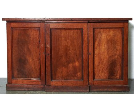 A Victorian mahogany compositor's cabinet, late 19th c, enclosed by three panelled doors and fitted with thirty six drawers w