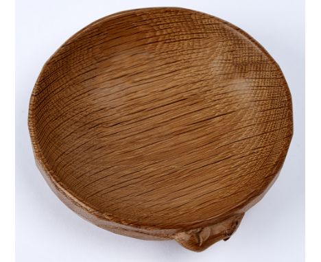 Robert 'Mouseman' Thompson of Kilburn - an adzed oak circular shallow bowl on foot, the side carved with signature mouse, 15.