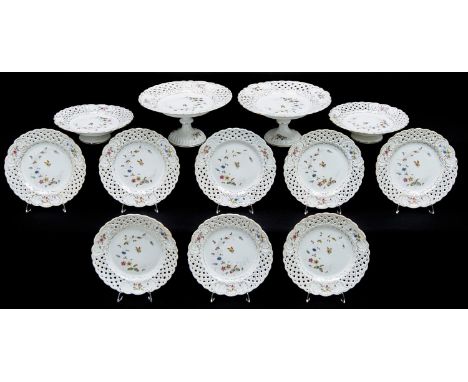 A German reticulated porcelain dessert service, Hermann Ohne, Silesia, late 19th c, decorated with insects and flowers in gil