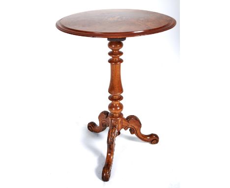 A Victorian walnut tripod table, the round, figured top inlaid with flowers on turned pillar and leaf carved legs, 68cm h x 5