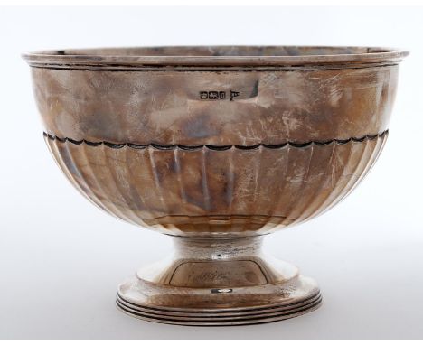 A George V silver rose bowl of fluted hemispherical form, on reeded foot, 20.5cm diam, by Walker &amp; Hall, Sheffield 1912, 