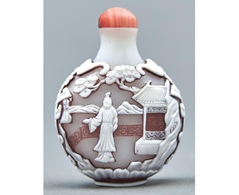 A Chinese triple overlay cameo glass snuff bottle, 20th c, in opal glass overlaid in pale brown and white and carved to eithe