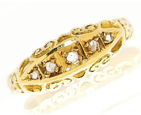 A five stone diamond ring with chip diamonds, in 18ct gold, Birmingham 1912, 2.5g, size M½  Light wear consistent with age