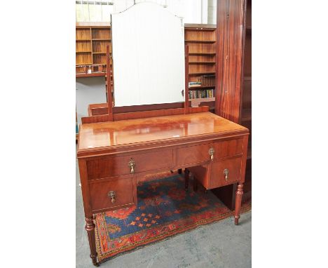 A two piece mahogany bedroom suite, 1920's, the chest of drawers with shallow upstand, three long graduated drawers on fluted