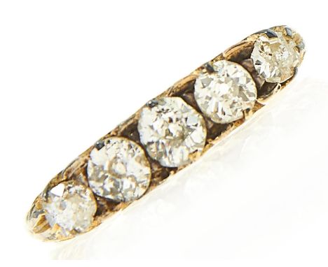 A five stone diamond ring, the cushion shaped old cut diamonds in gold, 2.7g, size P  Diamonds drawing some colour, one or tw