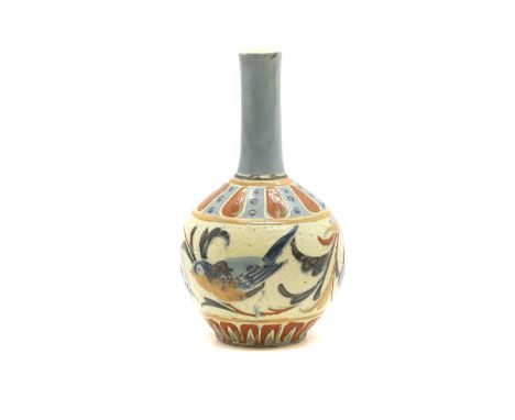 A Brannam Pottery solifleur vase. late 19th/early 20th century, of bulbous form with a long cylindrical neck, decorated throu