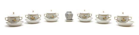 A Royal Copenhagen porcelain tea service  comprising six twin-handled cups and covers, 14cm wide, six saucers, 14cm diameter,