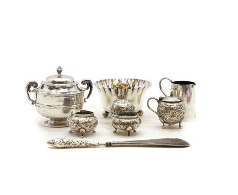 A collection of silver items comprising a four-piece Indian silver cruet set, tallest 5.8cm, a small cream jug by Charles &am