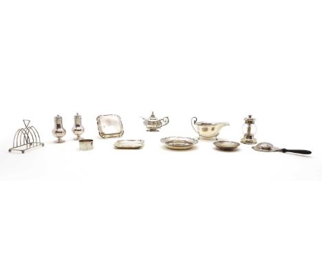 A collection of silver items to include a sauceboat, by Asprey, Birmingham 1949, 15cm wide, a four-division toast rack, Birmi