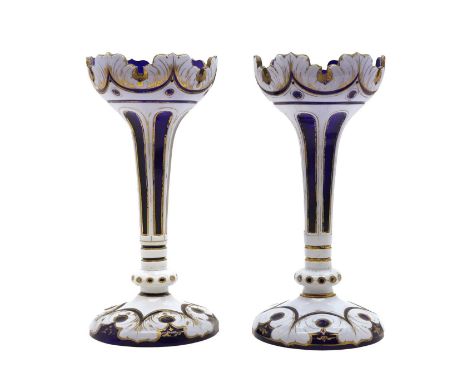 A pair of cased Bohemian glass lustres late 19th century, cased in opal over blue glass, with gilt highlights,30.5cm highCond