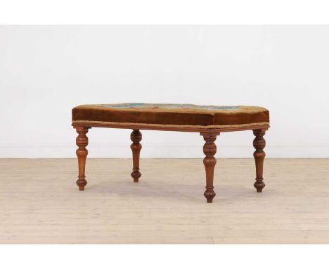 A Victorian walnut stool, mid-19th century, the rectangular top upholstered in needlepoint fabric decorated with hunting scen