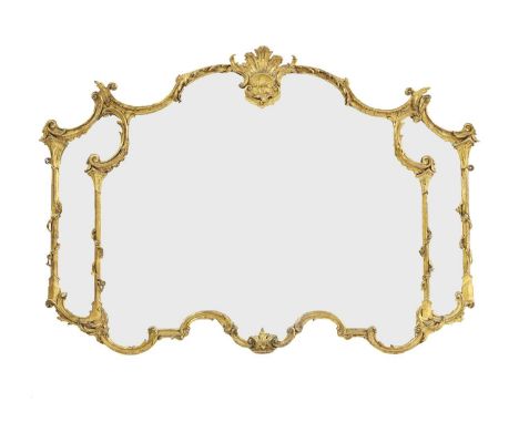 A gilt gesso overmantel mirror In the manner of Chippendale, with a scrolled foliate pediment, supported by Corinthian-style 