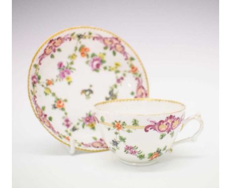 Champions Bristol porcelain cup and saucer, circa 1773-5, painted with floral garlands within rocaille cartouche borders with