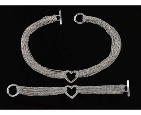Tiffany &amp; Co - A multistrand silver heart necklace and matching bracelet, with original cases and card boxesCondition rep