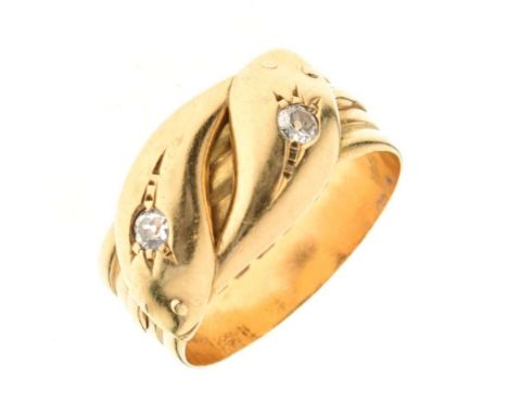 Diamond set double serpent 18ct gold ring, Birmingham 1914, the crossing snakes each set with an old brilliant cut to its hea