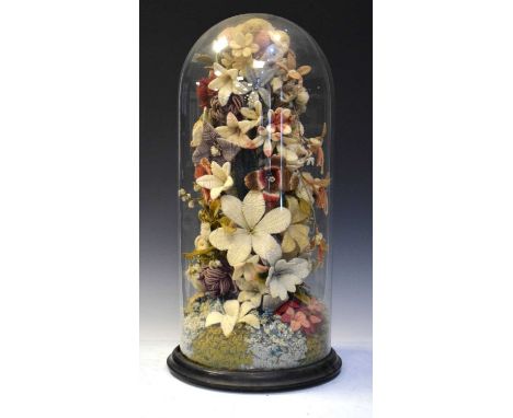 Late 19th/early 20th Century knitted flower arrangement, raised on ebonised wooden base beneath glass dome, 58cm high overall
