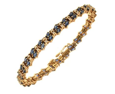 Sapphire and diamond bracelet, stamped '585', alternate set with twenty eight pairs of marquise sapphires and twenty seven pa