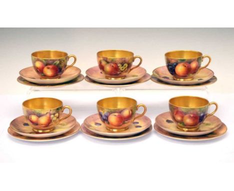 Six Royal Worcester porcelain fruit painted cups, saucers and plates, circa 1960s, comprising three 'trios', two signed J. Sm