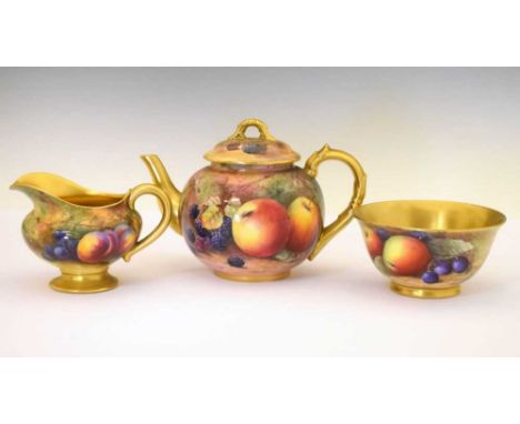 George V Royal Worcester porcelain fruit-painted teapot, milk jug and sugar basin, comprising: 'cannonball' teapot, H. Price,