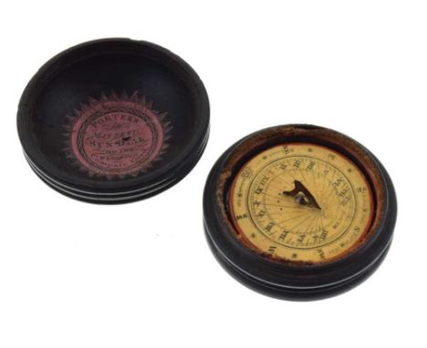 Early 19th Century treen pocket sun dial, the screw-on cover with paper label beneath 'Porter's magnetic Sun-Dial on the floa