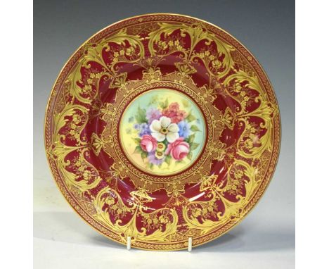 Royal Worcester porcelain cabinet plate, the central panel painted with floral spray signed by Nigel Creed, reserved on a ric