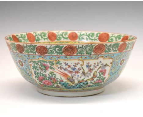 Chinese Canton Famille Rose porcelain bowl, decorated with panels of peacocks and other birds amongst foliage, reserved on a 