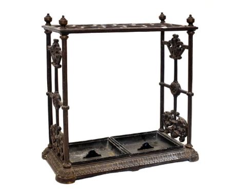 Victorian cast iron umbrella or stick stand, the rectangular frame with two rows of six divisions, the sides with scroll deco