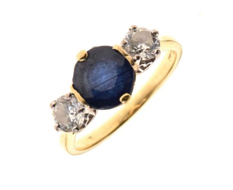 Sapphire and diamond three stone ring, the oval cut flanked to each side by a brilliant cut, the two diamonds totalling appro