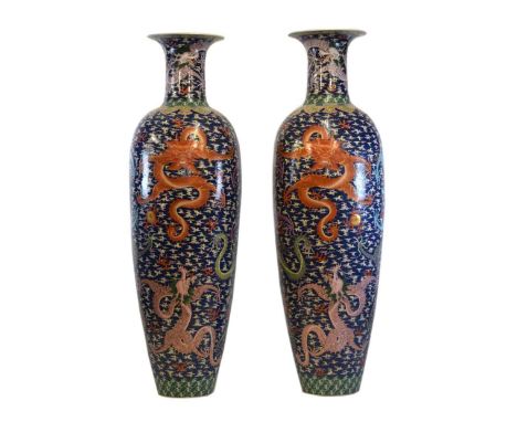 Pair of monumental Chinese porcelain floor standing vases, of shouldered baluster form painted in the Famille Rose palette wi